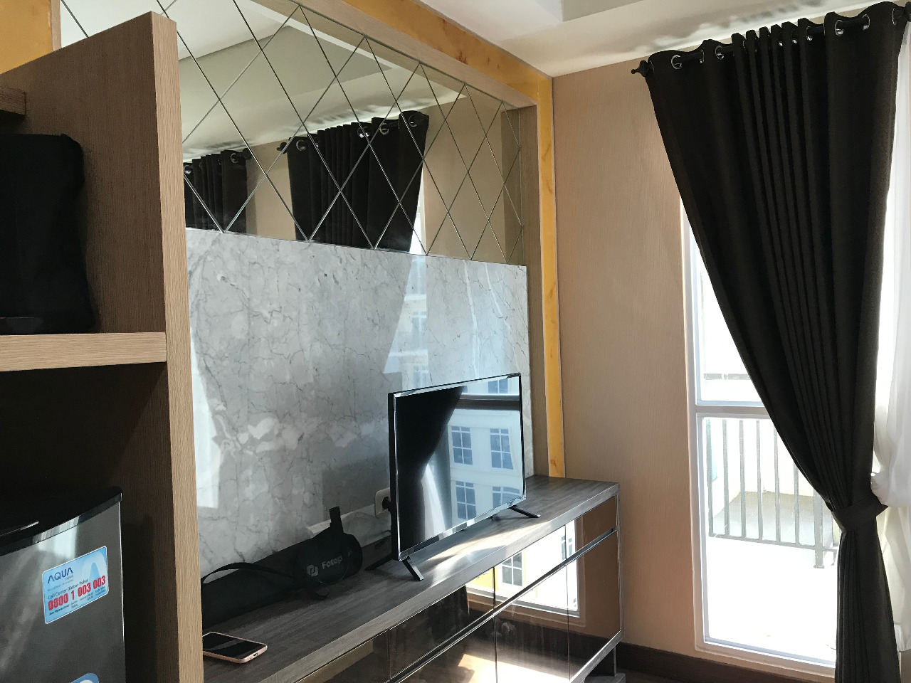 Dijual Apartemen studio Puri Orchard Tower A Samping Gedung OT